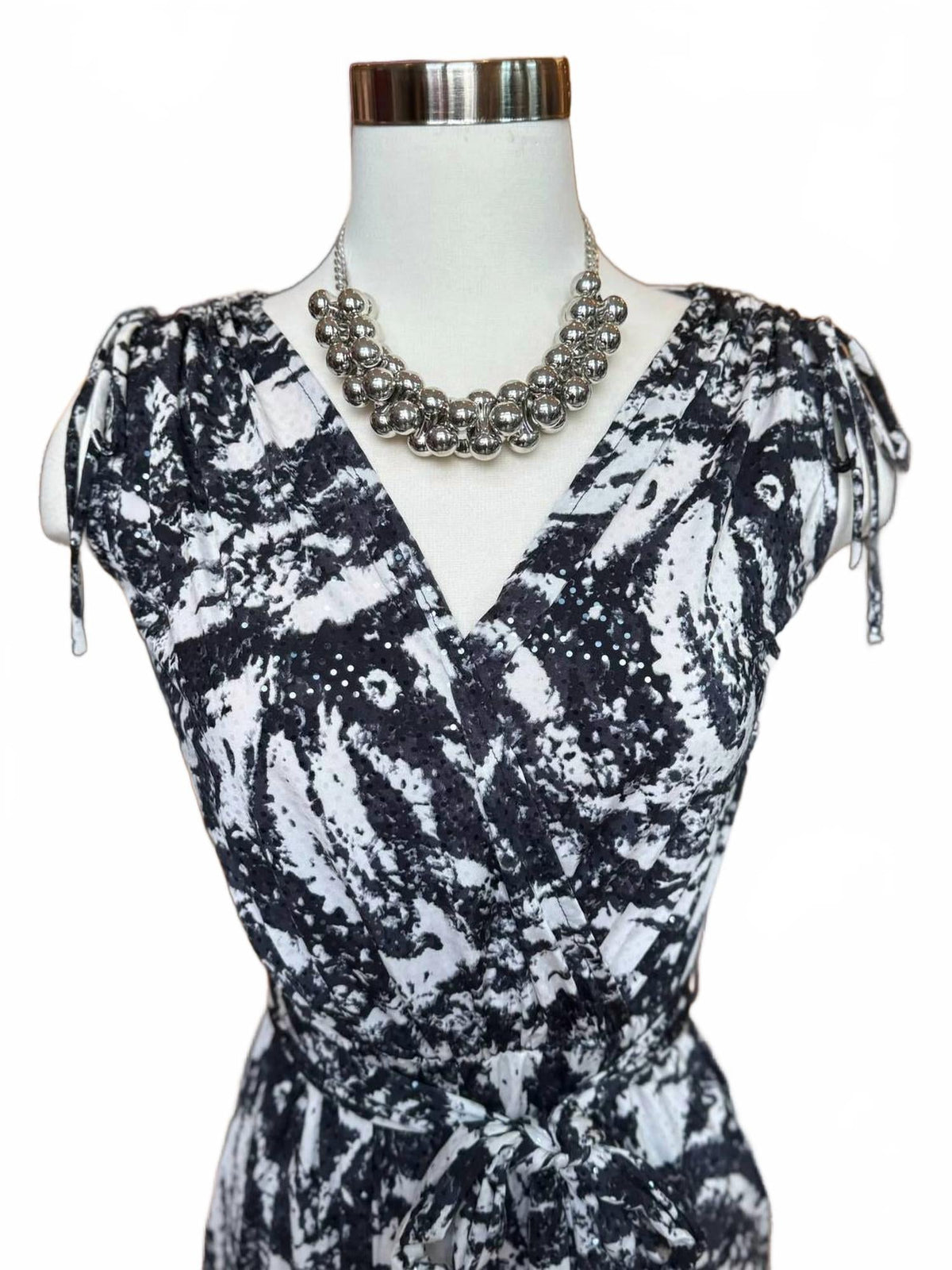 Printed Surplice Jumpsuit With Belt In Black Print